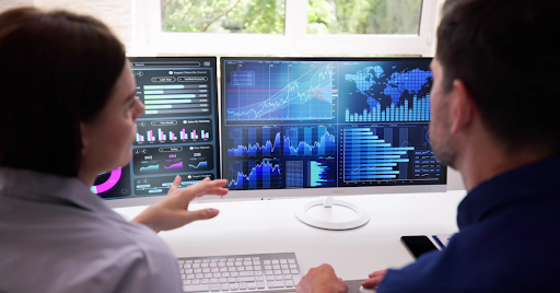 Coworkers looking at computers